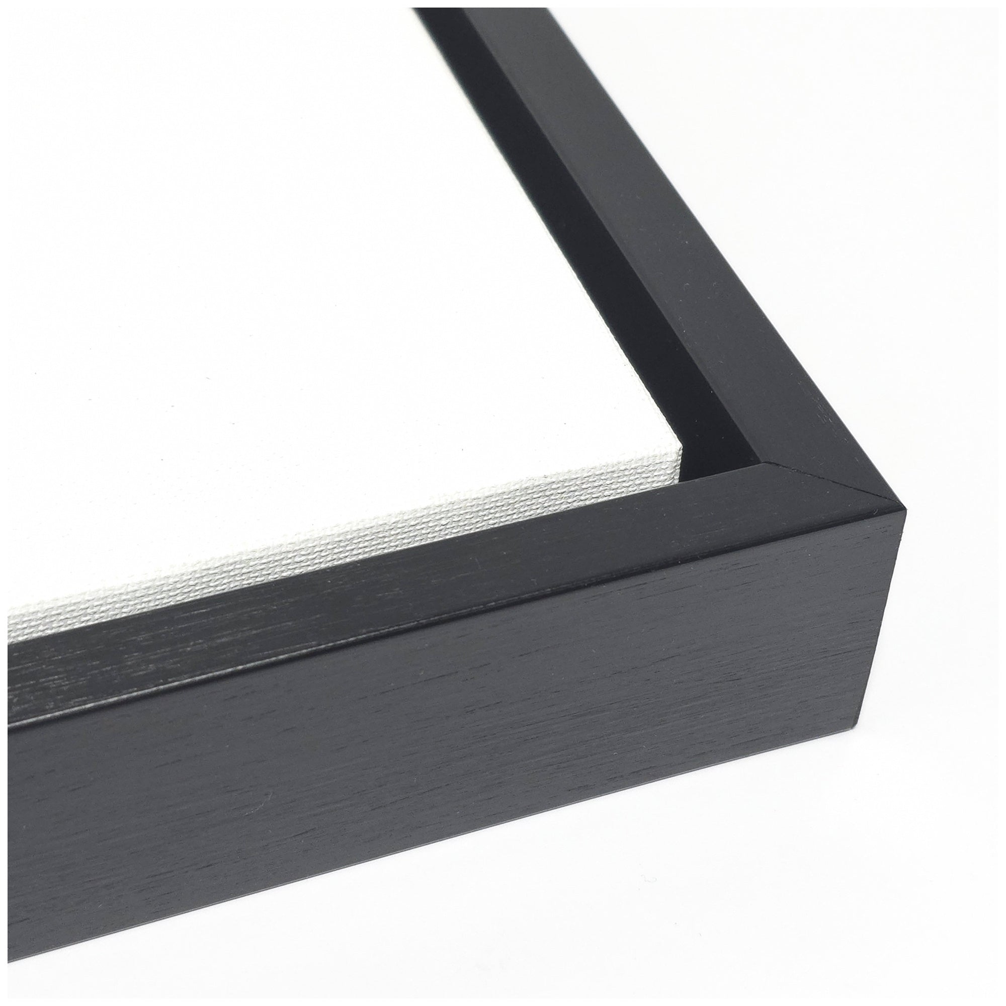 Close-up of a black picture frame corner on a white background