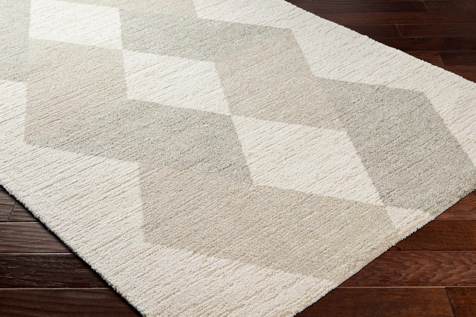 Geometric patterned rug on a wooden floor