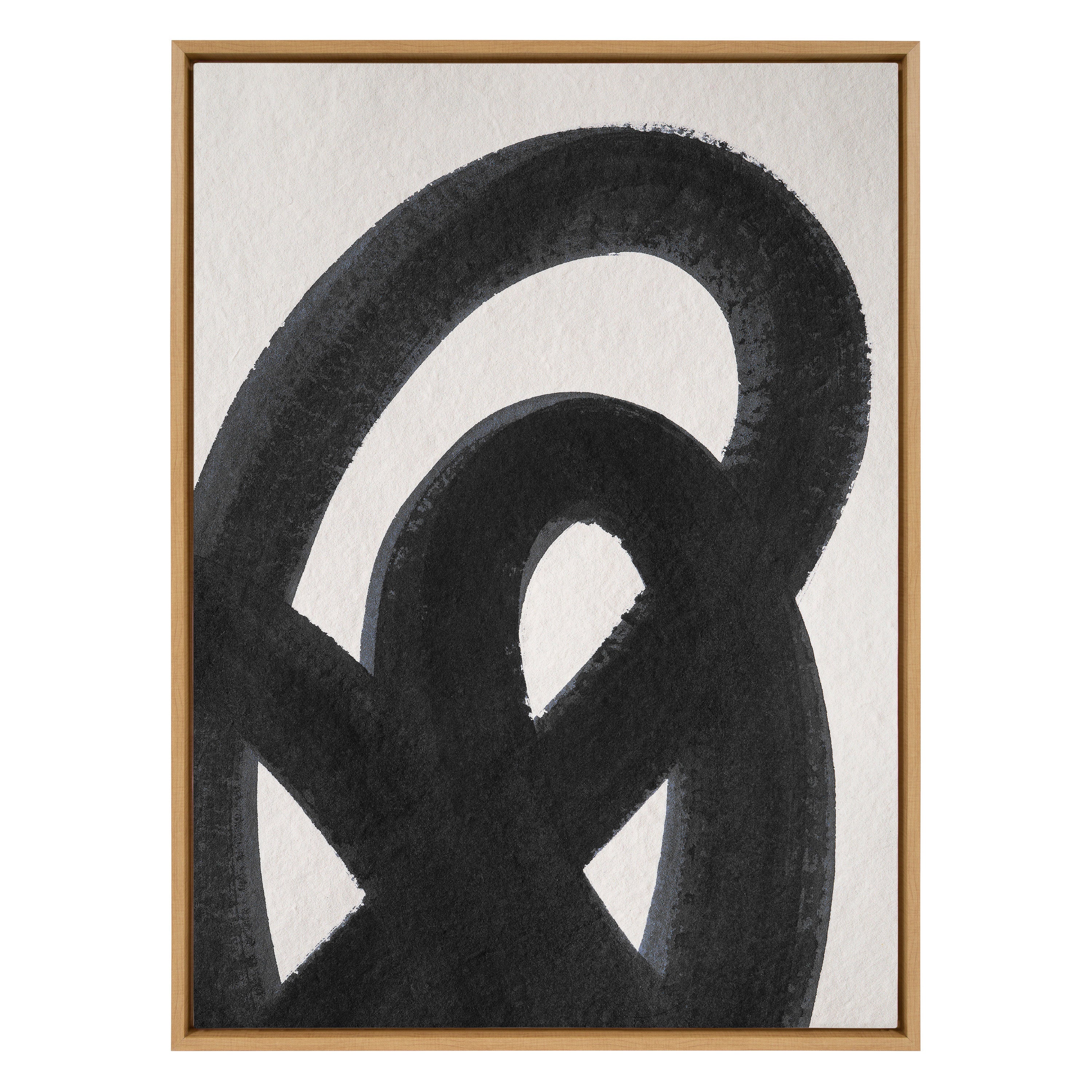 Abstract black and white artwork in a wooden frame on a light background