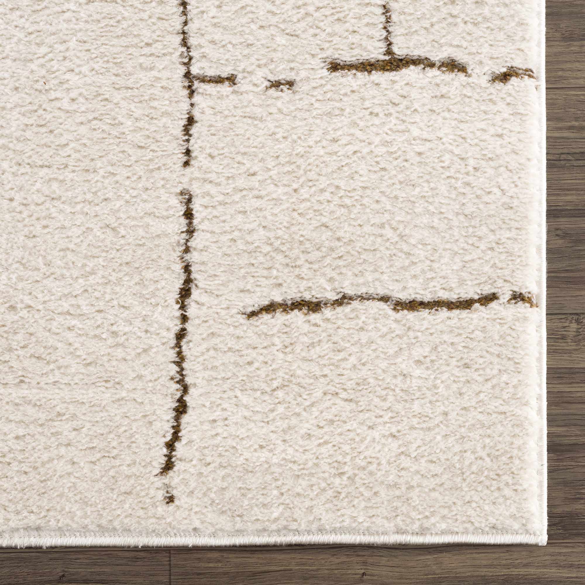Textured area rug with abstract brown patterns on a wooden floor