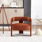 Brown armchair in a modern living room setting with decor elements.