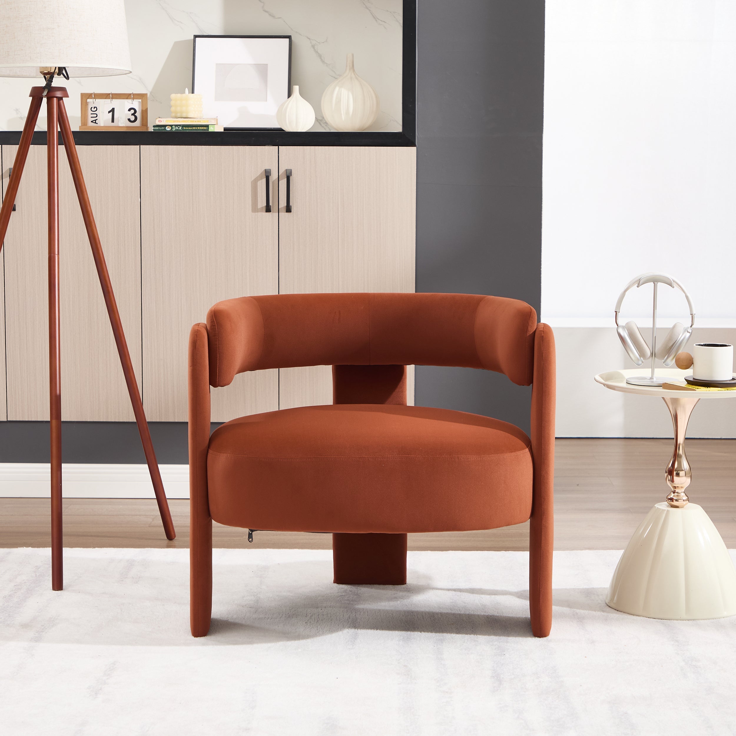 Brown armchair in a modern living room setting with decor elements.