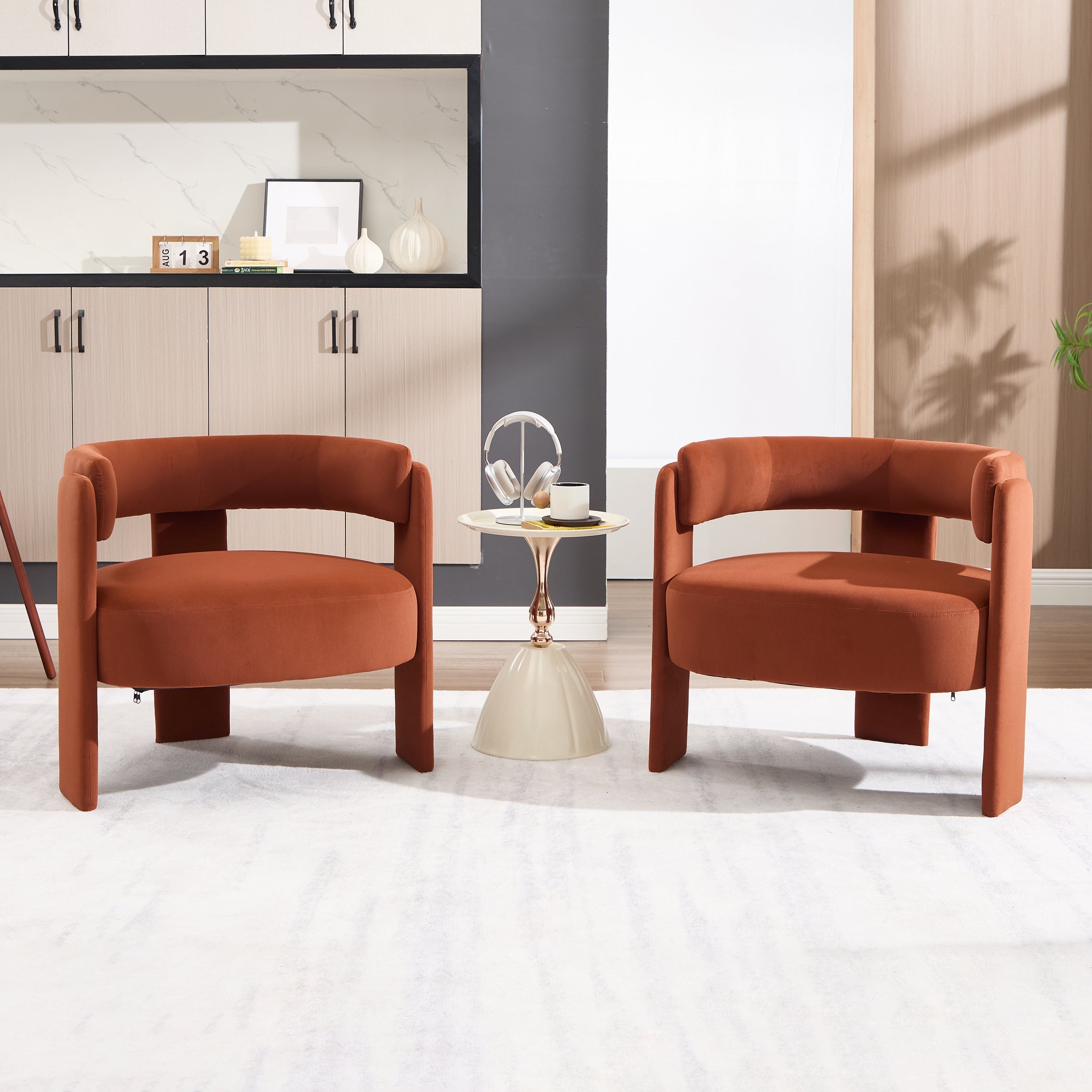 Two brown chairs in a modern living room setting with a small table between them.