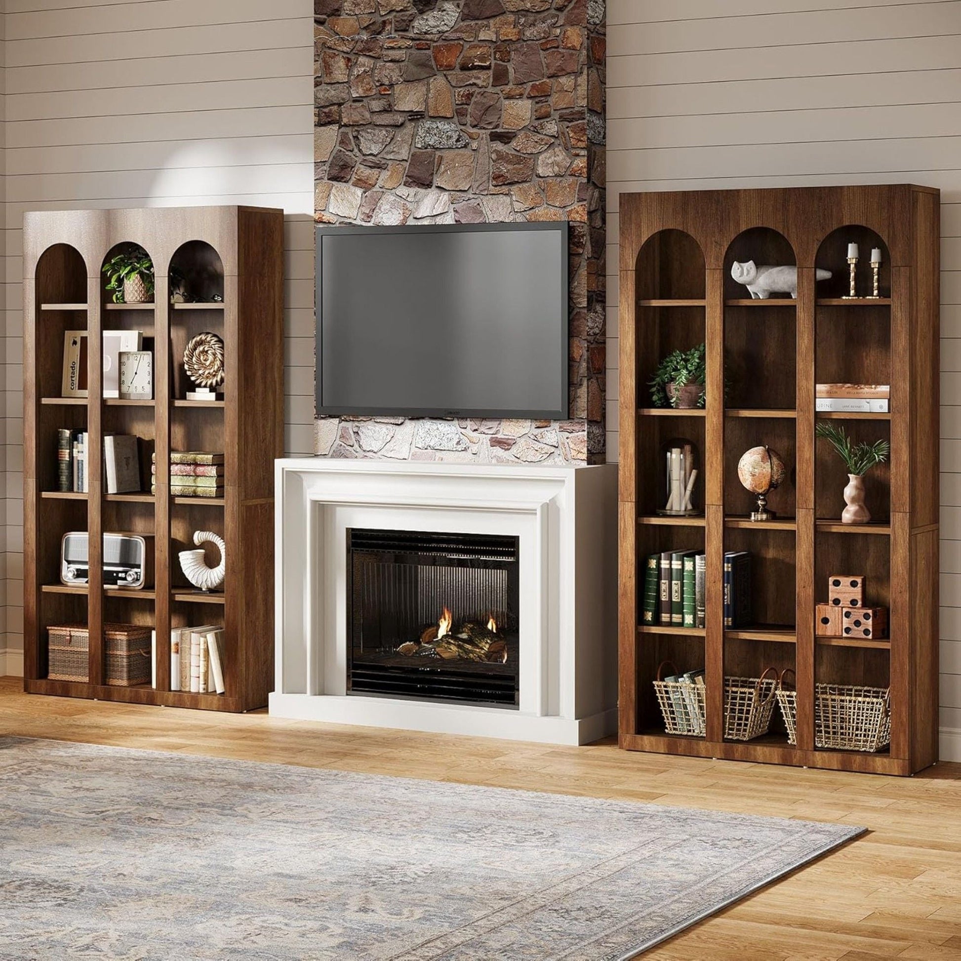 Living room with wooden bookshelves flanking a fireplace and TV.