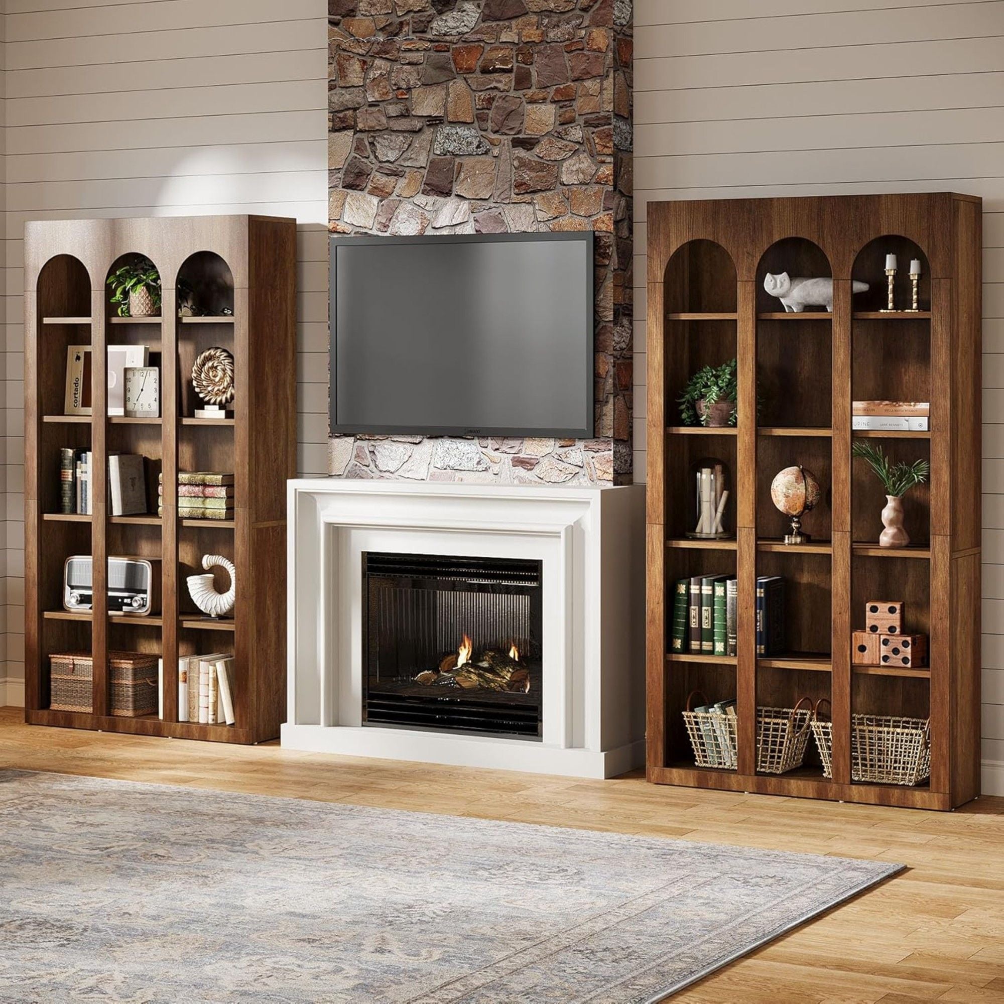 Living room with wooden bookshelves flanking a fireplace and TV.