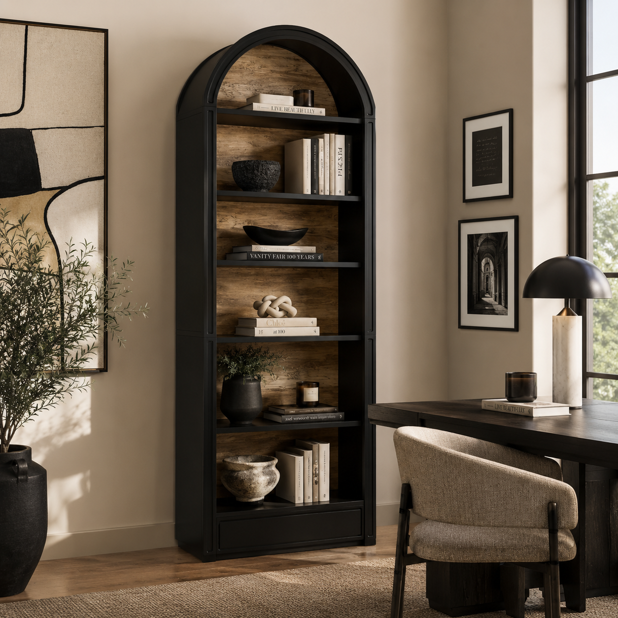 Arched bookshelf in a room with a desk and chair, decorated with books and decor items.