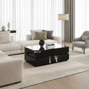 Black high-gloss coffee table with reflective surface in a room setting.