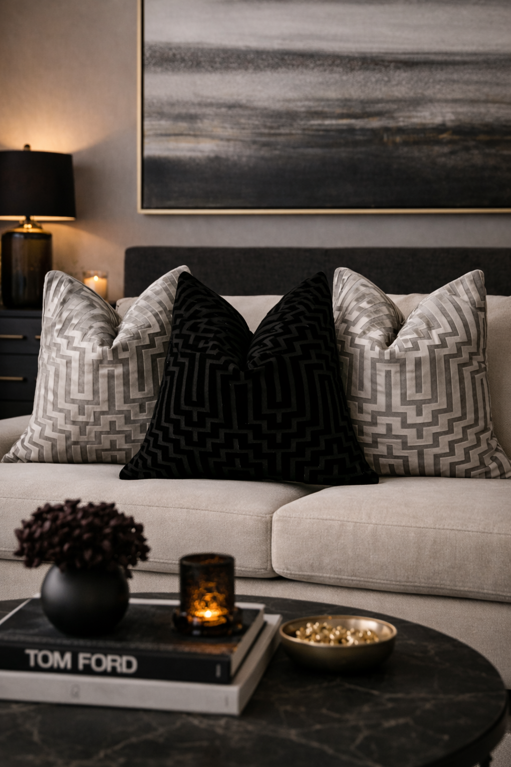 Decorative pillows on a sofa with a coffee table in a living room setting.